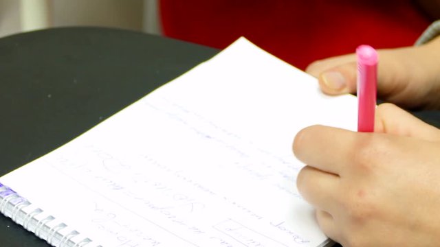 the left-hander keeps notes in the notebook