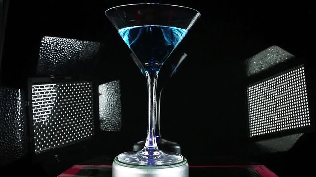 Blue curuacao cocktail on martini glass