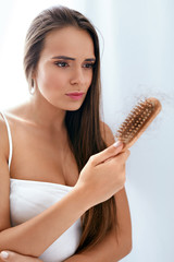 Hair Loss. Upset Woman Holding Brush With Hair