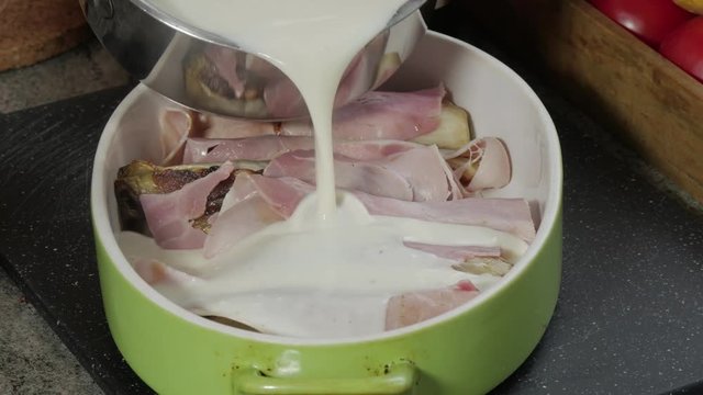 preparation of french endives gratin with ham and bechamel sauce