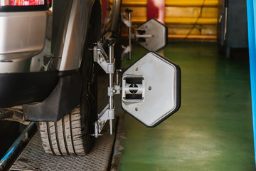 Car Steering Wheel Balancer Calibrate with laser reflector attach on each tire to center driving adjust