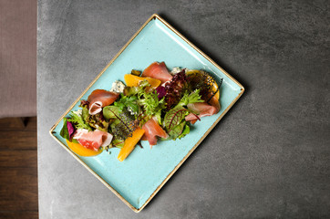 Ham and Peach Salad with Dor Blue on a Blue Plate