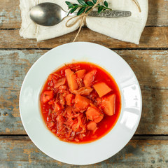 Traditional borscht (red beetroot soup) on the bowl. Top view