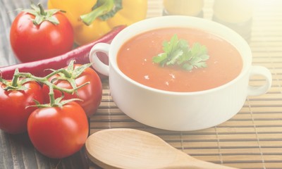 Bowl of gazpacho or tomato soup with ingredients