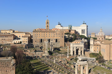Fototapeta premium Scenic sight in the Roman Forum, with the Campidoglio Hill, the Vittoriano monument and the Settimio Severo Arch.