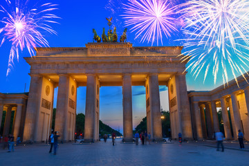 Brandenburg gate at night with fireworks, Berlin, Germany. HDR