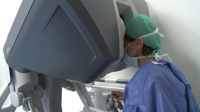 The doctor uses surgical robots gently
Surgery room