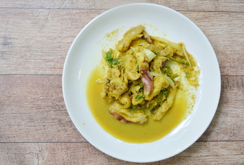 stir fried squid with yellow curry on plate