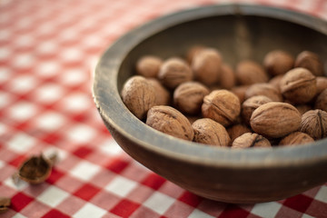 Walnuts in  old handmade wooden bowl ,