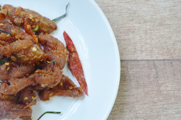deep fried chicken skin with chili and ginger sauce on plate