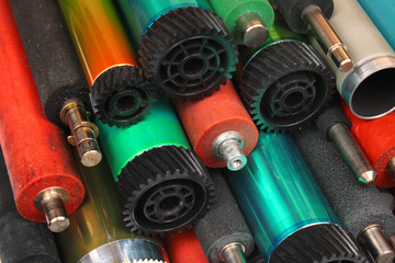 Parts of old laser printers. Photosensitive drums, rubber and metal shafts and rollers.