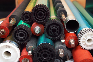 Parts of old laser printers. Photosensitive drums, rubber and metal shafts and rollers.