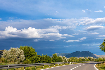 The road to the highlands, in Europe, blue sky in the mountains