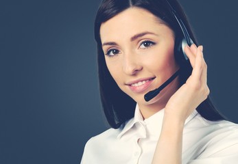 Woman Call Center operator on dark background