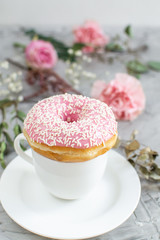 Cup with cappuccino, delicious doughnut, morning concept, bakery, fast carbs