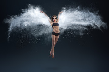 Fototapeta na wymiar Young woman with powder wings