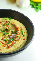 Homemade hummus with olive oil and paprika