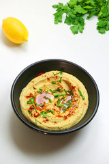 Homemade hummus with olive oil and paprika