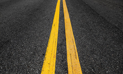 Yellow double dividing lines perspective view