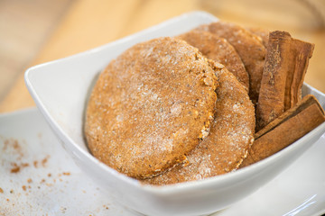 Fresh and tasty oat cookies with cinnamon sticks