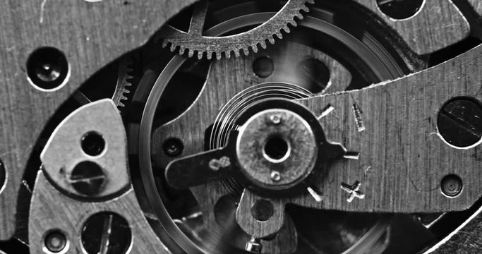 Black and white macro shot of mechanical watch movement
