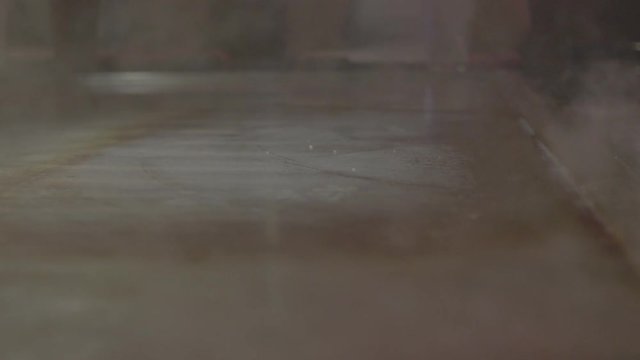 4k slow motion video clip of cook cleaning his work area