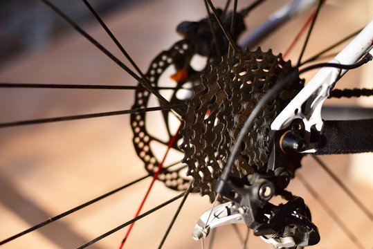 Bicycle parts rear wheel brake disc cassette fragment frame.