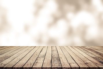 Wood table or wood floor with abstract gold bokeh background for product display