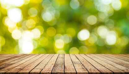 Old wood plank with abstract natural green blurred bokeh background for product display 