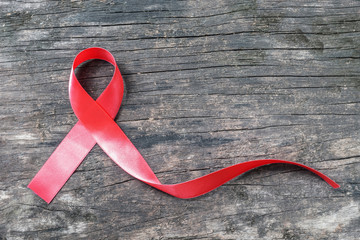 Red ribbon awareness for World aids day campaign supporting patient's with HIV virus, sexually...