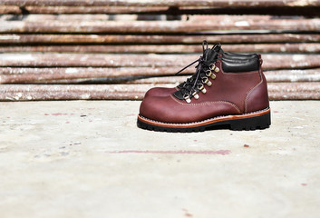 Brown boots on the concreat floor.