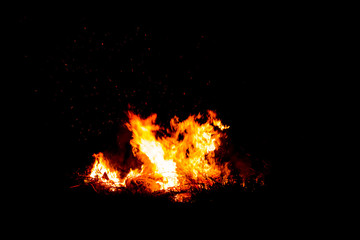 Fototapeta na wymiar Bonfire blur silhouette Black background red light