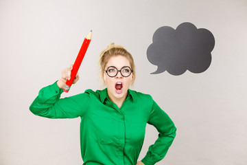 Angry teacher woman holding big pencil