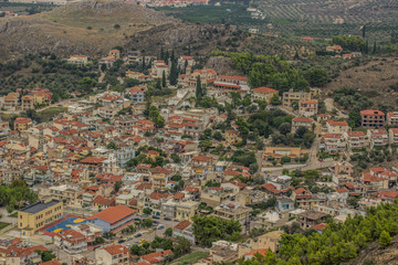 Fototapeta na wymiar city view buildings and landmarks from above in aerial shot to red and orange roofs oh houses in one of south countries
