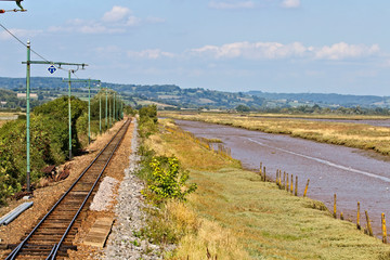 Fototapeta na wymiar The Seaton Tramway alongside the Axe Estuary, Devon, England, UK.