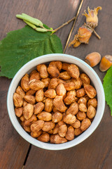 The hazelnut is the nut of the hazel and therefore includes any of the nuts deriving from species of the genus Corylus, especially the nuts of the species Corylus avellana. It also is known as cobnut.