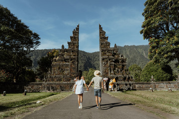 couple walking through the gate of Bali