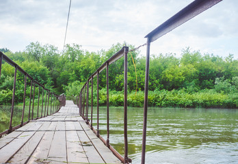 Small rustic bridge across river