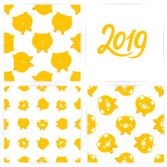 A set of seamless patterns with cute yellow pigs for the Chinese new year. 2019 hand lettering.