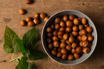 hazelnuts with wood background
