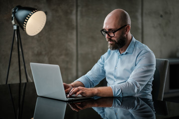 Middle-aged designer working in office
