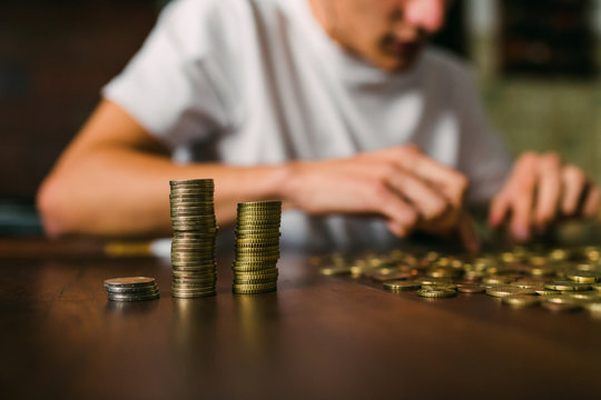 Crop guy counting coins