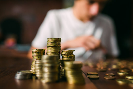 Crop guy counting coins