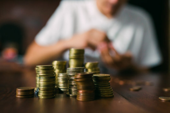 Crop guy counting coins
