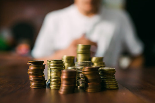 Crop guy counting coins