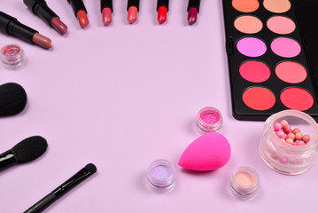 Professional makeup products with cosmetic beauty products, blushes, eye liner, eye lashes, brushes and tools.