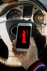 A IRRESPONSIBLE man driving a car with a MOBILE PHONE in his hand.A man holds a driving wheel and a...