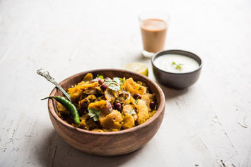 Homemade Kothu Parotta/ Paratha or Stir Fried Leftover Chapati Masala or  fodnichi poli in marathi, served in a bowl or plate with curd and hot tea. Selective focus