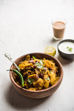 Homemade Kothu Parotta/ Paratha or Stir Fried Leftover Chapati Masala or  fodnichi poli in marathi, served in a bowl or plate with curd and hot tea. Selective focus