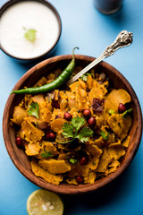 Homemade Kothu Parotta/ Paratha or Stir Fried Leftover Chapati Masala or  fodnichi poli in marathi, served in a bowl or plate with curd and hot tea. Selective focus